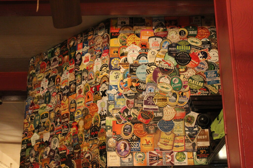 The Harp, Pump Clips Above The Bar. Tours of the UK